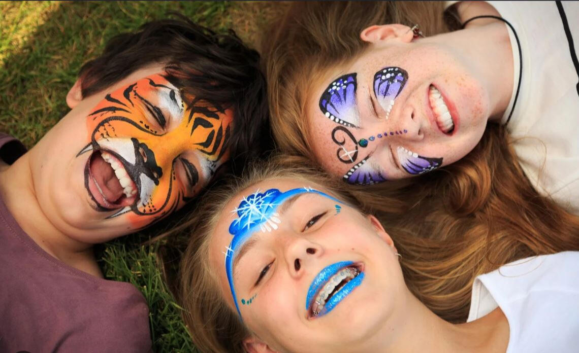Butterfly face painting at a Santa Barbara birthday party Colorful tiger face paint for a child